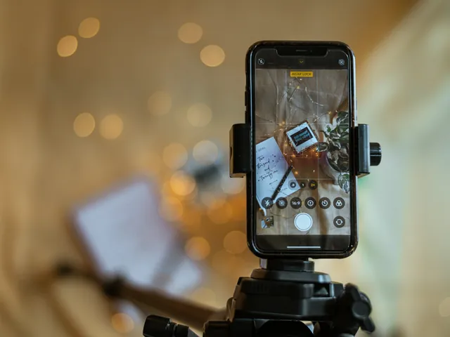 A phone on a tripod filming a product on a desk