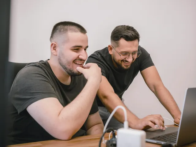 Two founders working through a screen together