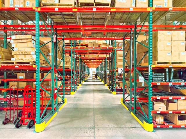Aisles of stocked pallet racks in a warehouse